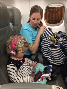 This lil girl was a saint on these flights.  She watched shows on a phone, wore headphones, and napped and snacked like a champ!